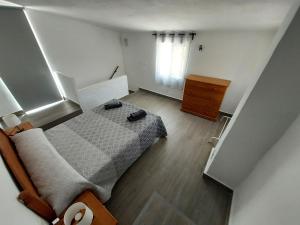 Postel nebo postele na pokoji v ubytování Mirador del Torrecilla