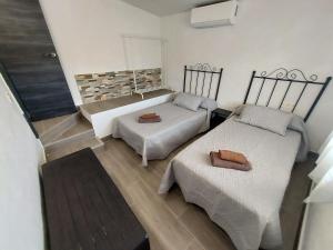 Postel nebo postele na pokoji v ubytování Mirador del Torrecilla + 37 fotografií