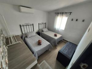 Postel nebo postele na pokoji v ubytování Mirador del Torrecilla