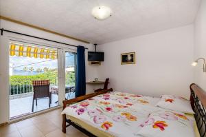 Postel nebo postele na pokoji v ubytování Apartments Marika