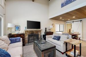 a living room with a couch and a fireplace at Forest Pines Condo 1 - 46 in Incline Village