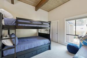 a bedroom with bunk beds and a window at Forest Pines Condo 1 - 46 in Incline Village