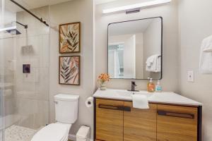 a bathroom with a toilet and a sink and a shower at Morning Star Retreat in Vashon +35 photos