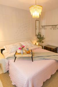 a bedroom with a bed with a tray of fruit on it at Back in Time Luxury Dubrovnik 2 in Dubrovnik +37 photos