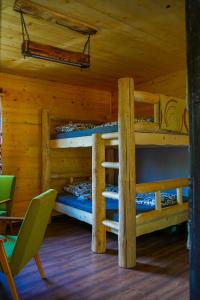 a room with two bunk beds in a cabin at Na samote u lesa in Revúca
