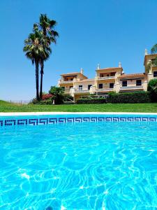 Bazén v ubytování Vistas al Guadiana, Chalet a 10 minutos de la playa nebo v jeho okolí