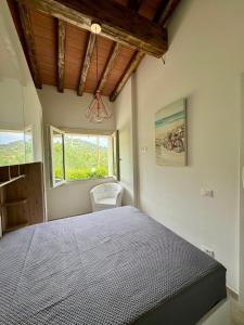Postel nebo postele na pokoji v ubytování VILLETTA LE PAVANE ISOLA D'ELBA