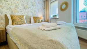 Posteľ alebo postele v izbe v ubytovaní Apartament Parkowy by RENT4YOU + 22 fotografií