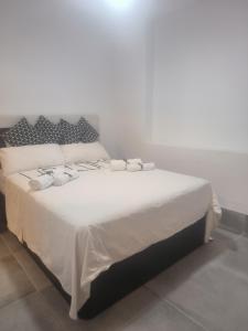 Posteľ alebo postele v izbe v ubytovaní Pinar Suites Habitaciones