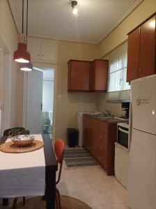 Кухня или мини-кухня в Gerasimos Apartment Φωτεινό Καινούριο Διαμέρισμα στην καρδιά του Μεσολογγίου
 +30 фотографий