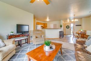 a living room with a couch and a table at Cozy Sioux Falls House - Walk to Park! in Sioux Falls
