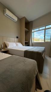 Postel nebo postele na pokoji v ubytování Hotel Minorus