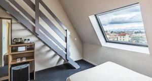 Postel nebo postele na pokoji v ubytování Best Western Hotel Atrium Valence