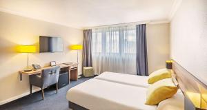 Postel nebo postele na pokoji v ubytování Best Western Hotel Atrium Valence