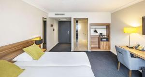 Postel nebo postele na pokoji v ubytování Best Western Hotel Atrium Valence