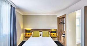 Postel nebo postele na pokoji v ubytování Best Western Hotel Atrium Valence