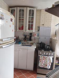 Η κουζίνα ή μικρή κουζίνα στο Aluga se quarto individual não compartilhado +7 φωτογραφίες