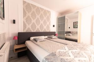 a bedroom with a large bed in a room at Danube Dwelling Hercegprimas 2 in Budapest