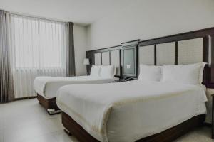 Katil atau katil-katil dalam bilik di Hotel D'Carlo Class