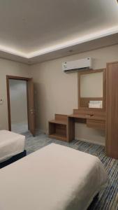 Voodi või voodid majutusasutuse شقق هوليداي بلس مشرفه - Holiday Plus Mishrifah Apartments toas
