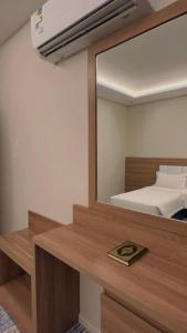 Voodi või voodid majutusasutuse شقق هوليداي بلس مشرفه - Holiday Plus Mishrifah Apartments toas