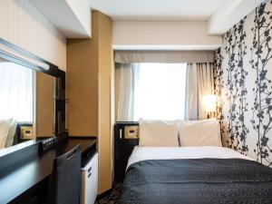 Postel nebo postele na pokoji v ubytování APA Hotel Osaka Kadomashi Ekimae + 37 fotografií