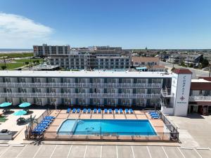 an aerial view of a hotel with a pool at Compass Family Resort in Wildwood Crest