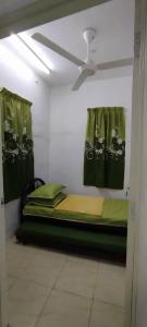 Ένα ή περισσότερα κρεβάτια σε δωμάτιο στο Saaidah Homestay