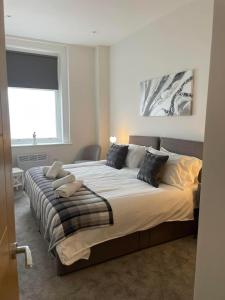 เตียงในห้องที่ Flat 2 ,559 Wimborne Road