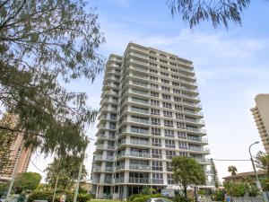 a tall white apartment building in a city at Boulevard Towers on Broadbeach in Gold Coast
