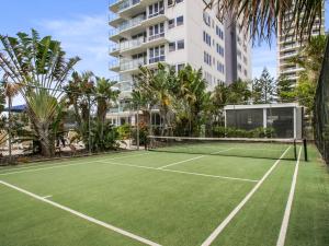 a tennis court in front of a building at Boulevard Towers on Broadbeach in Gold Coast
