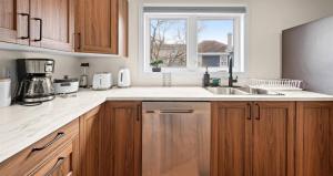 a kitchen with a sink and a dishwasher at Serenity Getaway in Halifax