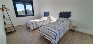 Ένα ή περισσότερα κρεβάτια σε δωμάτιο στο Apartamento A Cachola