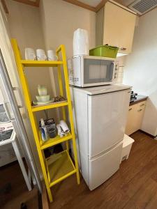 Η κουζίνα ή μικρή κουζίνα στο ハイムユアーズ207