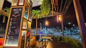 a restaurant with a view of a street at night at Valle Sur Hotel Moquegua in Moquegua