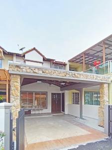 a house with a large patio in front of it at 13Pax -2 Storey Bayu Mutiara Bukit Mertajam Penang in Bukit Mertajam