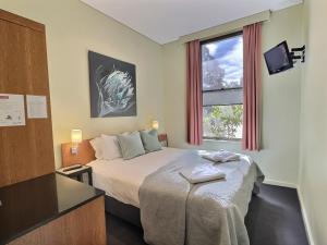 Ein Bett oder Betten in einem Zimmer der Unterkunft The Grand Oaks Resort
