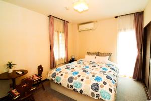 Ένα ή περισσότερα κρεβάτια σε δωμάτιο στο Belle Vue Nishiura