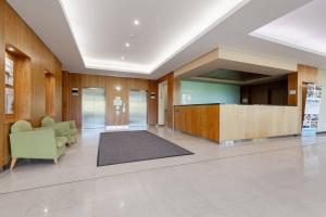 a lobby with a waiting area in a building at 2X1 Comfy Apartment in Perth CBD in Perth