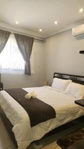 מיטה או מיטות בחדר ב-Villa Serene Lusaka