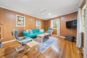 TV at/o entertainment center sa A Turtle House by Discover Stradbroke