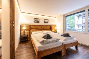 Postel nebo postele na pokoji v ubytování Village Center Apartment Kanne