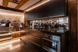 Kuchyň nebo kuchyňský kout v ubytování Village Center Apartment Kanne + 23 fotografií