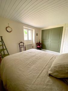 מיטה או מיטות בחדר ב-Le Clos Boissière - Gîte Cosy