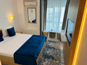 Tempat tidur dalam kamar di STEAUA DE MARE - Olimp Resort