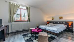 Voodi või voodid majutusasutuse Hotel Tulipan toas