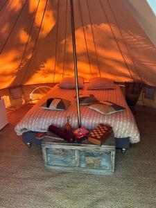 a bedroom with a bed and a table with food on it at CYBÈLE in Bernac