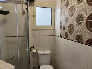 A bathroom at Lovely gorgeous apartment among green Maadi