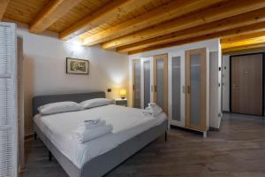 Posteľ alebo postele v izbe v ubytovaní Inn Aosta Apartments