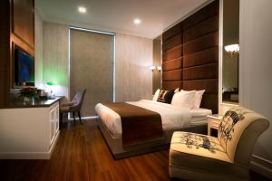 Postel nebo postele na pokoji v ubytování H Boutique Hotel Sri Petaling